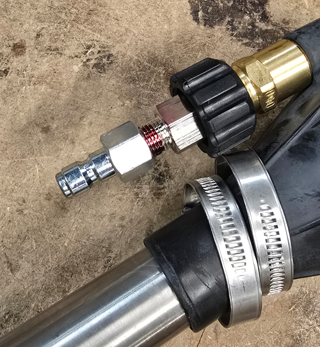 V-TUF sludge sucker kit adaptor close-up showing pressure washer coupling and hose barb