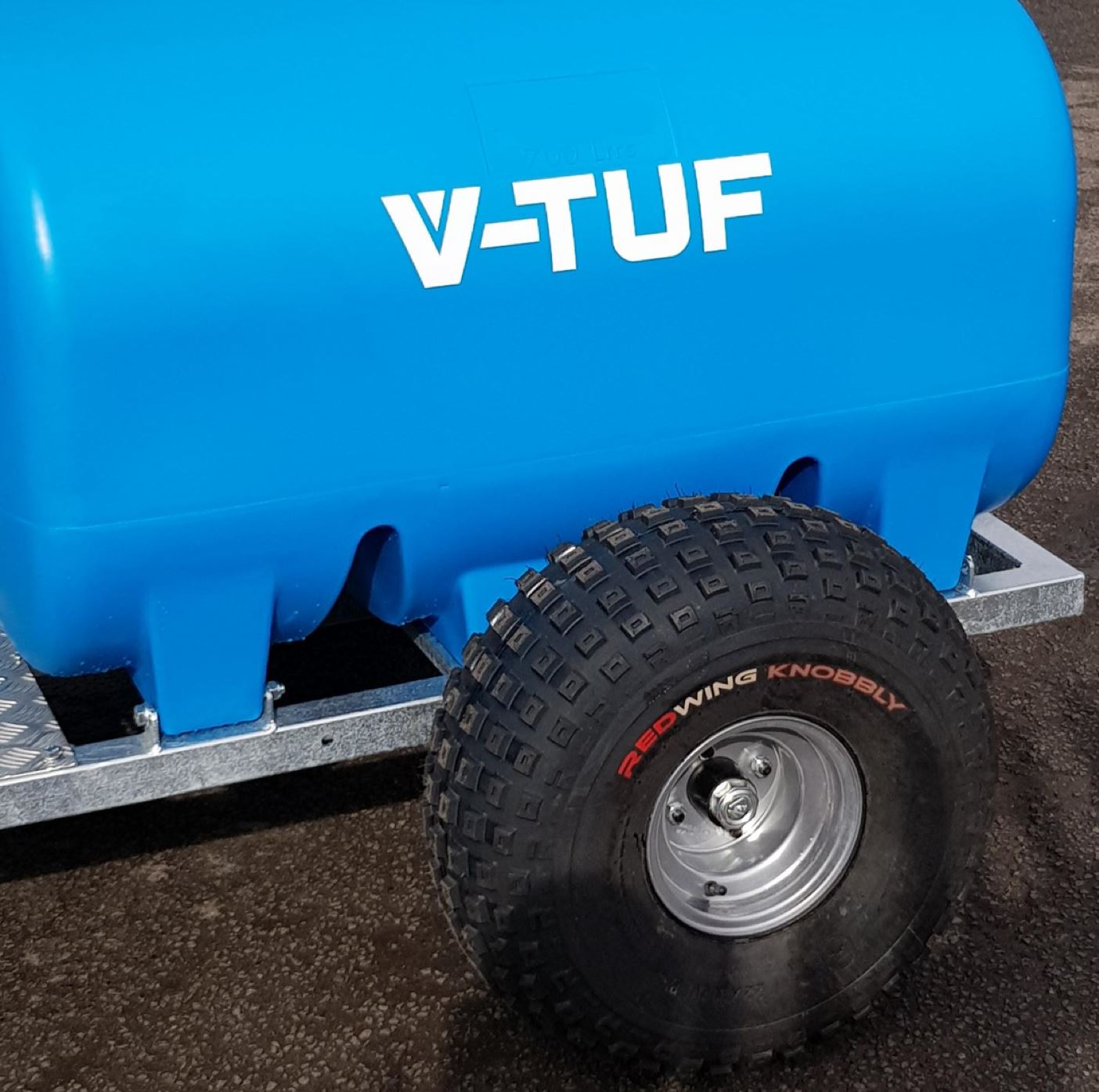 V-TUF DELUGE 700L ATV bowser in use showing pressure washer mounted and hose deployed