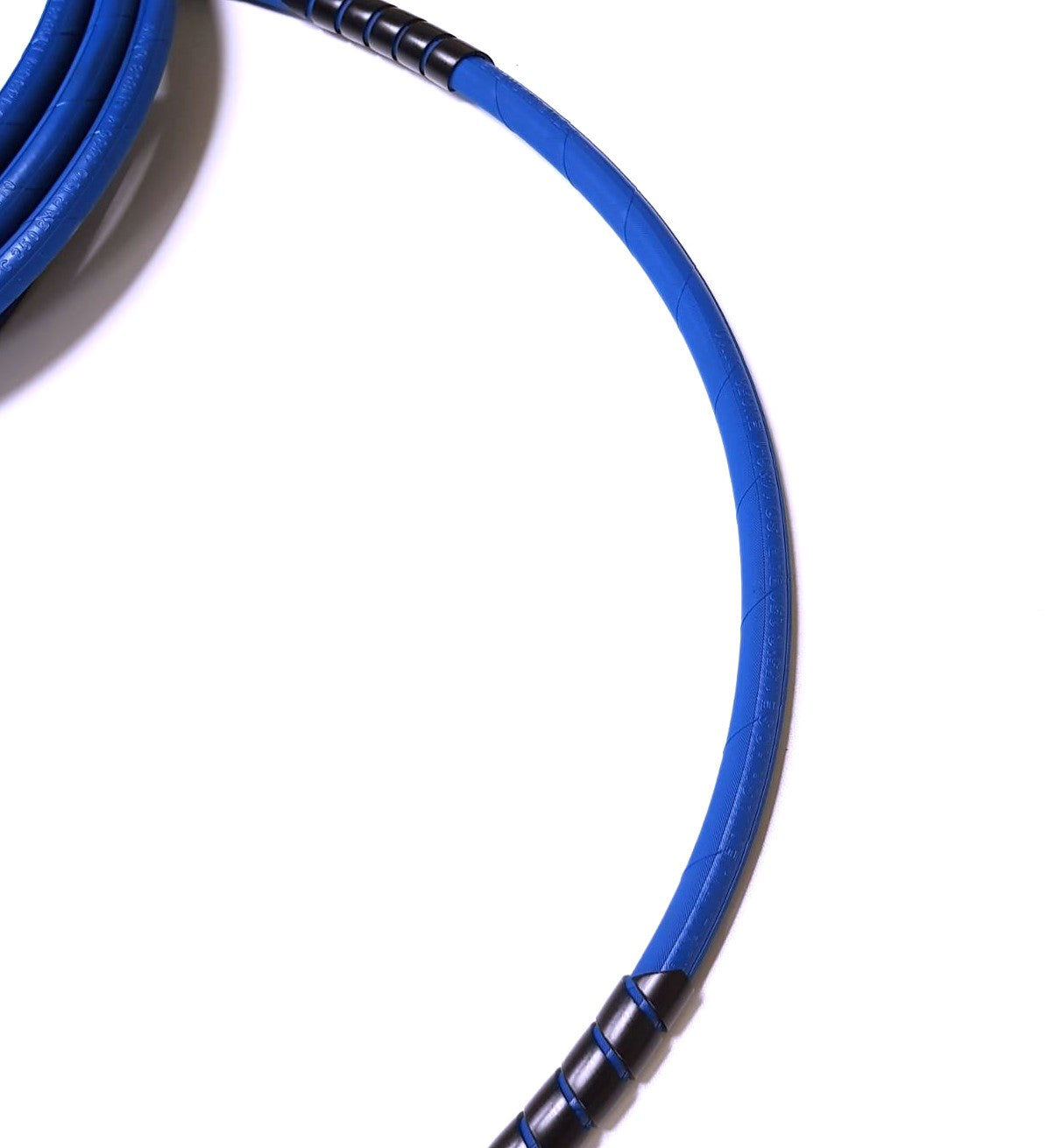 V-TUF SPIRAL10 wrap installed on pressure washer hose showing full length coverage