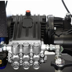 V-TUF D10 diesel washer in use showing operator pressure washing with 200 Bar output